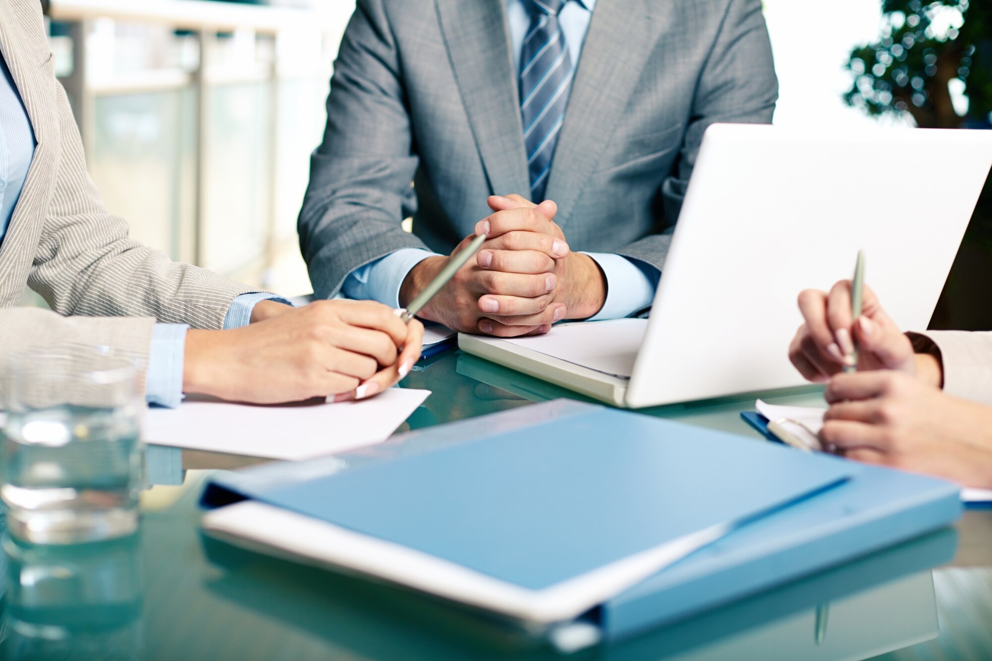 close-up-executives-sitting-table_1098-2159